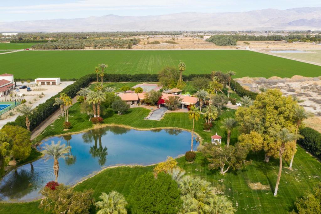 Palm Springs House | Paradiso by AvantStay Pool Lake Fire Pit Billiards Room Elegant Secluded Estate