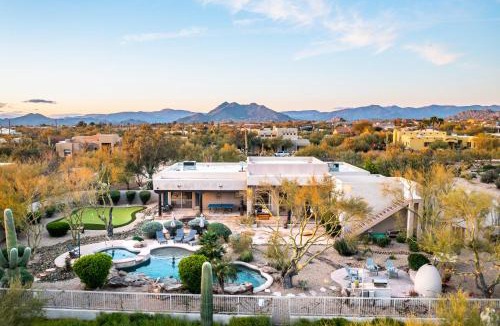 Desert View Village House | Barwick is a private oasis Practice on the putting green shoot pool and enjoy this city getaway.