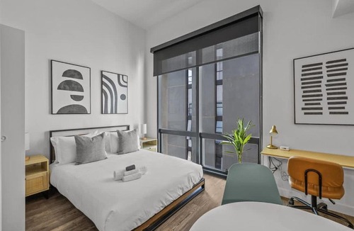 Evans Churchill Apartment | Boulevard Stays Modern Highrise STU Sky Pool Parking Gym 05