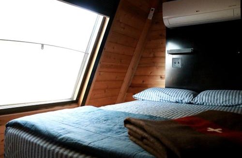 Allen County Ski Chalet | Charming A-Frame Cabin Experience with Campfire Vibes in Humboldt, Kansas