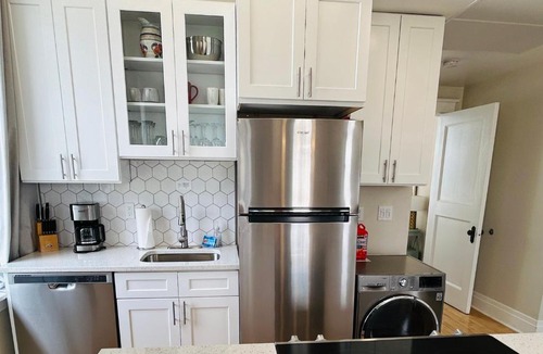 Boise Apartment | Downtown Digs-View of the City! Stay above local restaurants and nightlife, posh amenities heated toilet seat, oversized rain shower head in glass shower, in-unit laundry, one garage parking spot