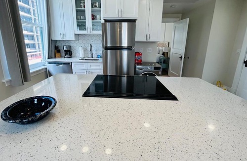 Boise Apartment | Downtown Digs-View of the City! Stay above local restaurants and nightlife, posh amenities heated toilet seat, oversized rain shower head in glass shower, in-unit laundry, one garage parking spot