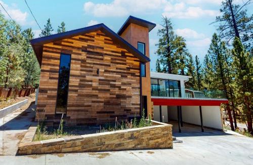 The Village House | Hillside Hideaway ~ Dog-friendly home with wraparound deck, grill, game room, & bar - walk to dining