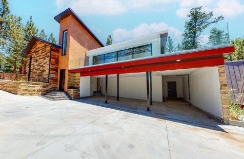 The Village House | Hillside Hideaway ~ Dog-friendly home with wraparound deck, grill, game room, & bar - walk to dining