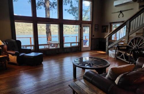 Joseph House | Lakefront home with wraparound deck modern appliances WiFI & dog-friendly