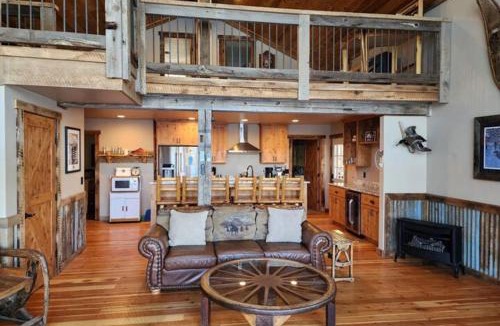 Joseph House | Lakefront home with wraparound deck modern appliances WiFI & dog-friendly