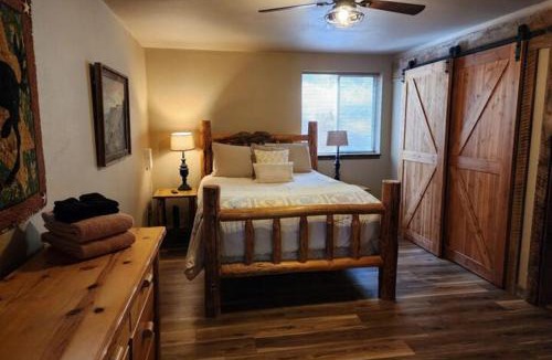 Joseph House | Lakefront home with wraparound deck modern appliances WiFI & dog-friendly