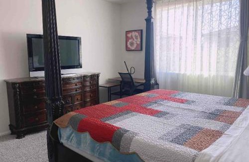 Riverside House | Large master bedroom with Separate bathroom and work desk on the first floor