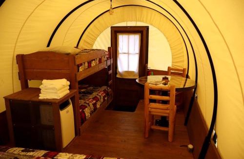 Granite County House | Rustic Conestoga Wagon Stay with Lodge Amenities near Boulder Creek, Montana