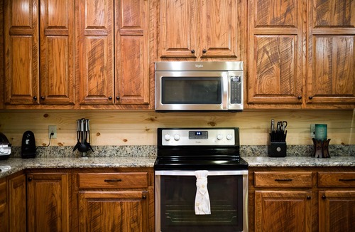 Broken Bow Cabin | Treasured Times-Spacious living area; Hot tub; Playset; Large yard!