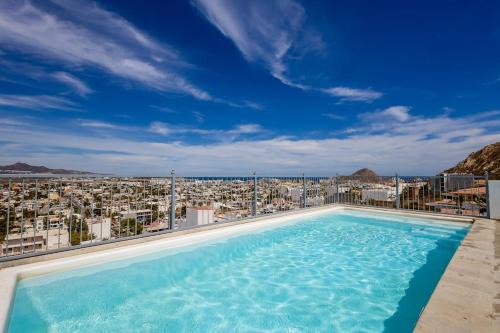 Hotel suite with ocean-view rooftop infinity pool, balconies & AC