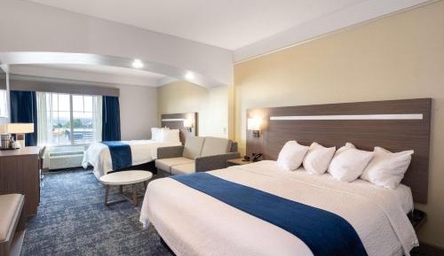 Larger Room with One King and One Queen Bed and Sofa - Non-Smoking