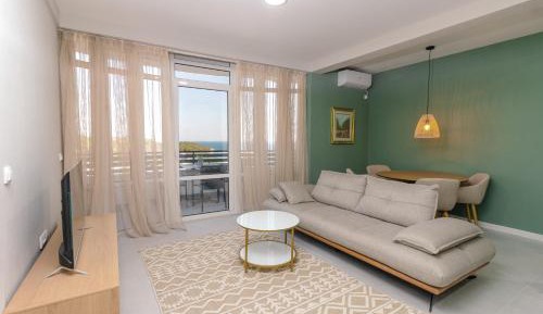 One-Bedroom Apartment with Balcony and Sea View